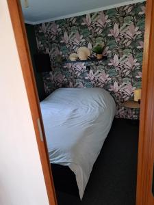 Кровать или кровати в номере Knusse chalet in een schitterende omgeving