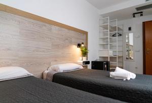 Postel nebo postele na pokoji v ubytování Hotel Ridomar 365