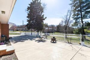 a park with benches and a fence and a tree at Harbor Riverside Property 1 in Fort Washington