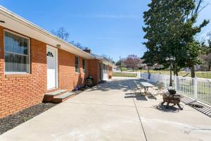 a sidewalk next to a brick building with a bench at Harbor Riverside Property 2 in Fort Washington