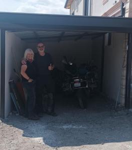 a man and a woman standing in a garage at Ipekyolu Garden in Avanos