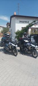 a row of motorcycles parked in a parking lot at Ipekyolu Garden in Avanos