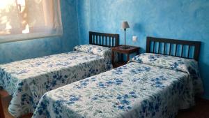 Säng eller sängar i ett rum på Villa La Parra en el corazón de la Sierra de Gata