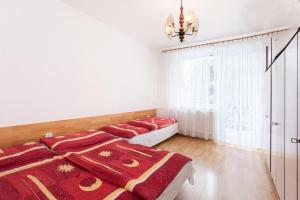 A bed or beds in a room at Byt Zuzana