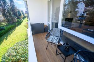 Κήπος έξω από το OrangeHome Design Apartment zwischen See & Zentrum