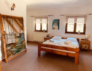 Postel nebo postele na pokoji v ubytování Restauracja Pensjonat Buda