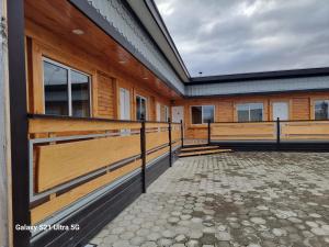 a horse stall on a house with a fence at Loft Altos Suite in Puerto Natales