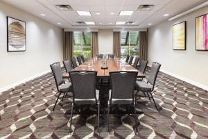a conference room with a long table and chairs at Residence Inn by Marriott Daytona Beach Speedway/Airport in Daytona Beach +22 photos