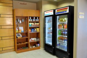 a store with two refrigerators in a store at SpringHill Suites Galveston Island in Galveston