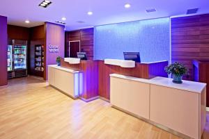 a lobby of a store with purple at Fairfield Inn & Suites by Marriott St. Paul Northeast in Vadnais Heights