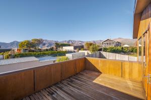 a view from the balcony of a house at Lake Hawea Haven - Lake Hawea Holiday Home in Lake Hawea