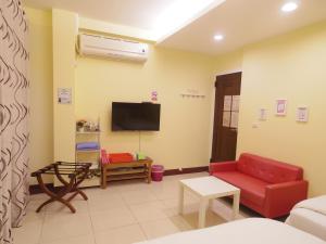 TV a/nebo společenská místnost v ubytování Taitung Love Hostel + 7 fotografií