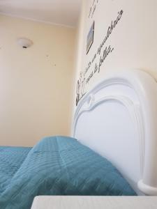 Postel nebo postele na pokoji v ubytování Casa vacanza Tommy