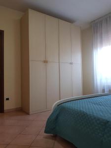 Postel nebo postele na pokoji v ubytování Casa vacanza Tommy