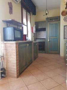 Kuchyň nebo kuchyňský kout v ubytování Casa vacanza Tommy + 30 fotografií