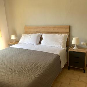 Postel nebo postele na pokoji v ubytování Hotel Helvetia