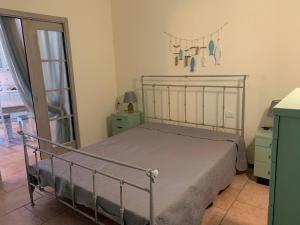 En eller flere senger på et rom på Residence Il Fiocco