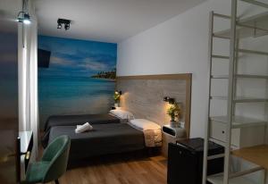 Postel nebo postele na pokoji v ubytování Hotel Ridomar 365 + 37 fotografií