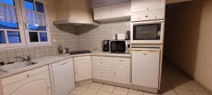 Kuchnia lub aneks kuchenny w obiekcie Maison Saint Jean de Monts 7 personnes - 3 chambres