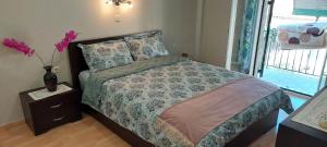 A bed or beds in a room at Flora's Boutique Apartment at the heart of Corfu
