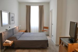 Postel nebo postele na pokoji v ubytování Albergo Alla Posta
