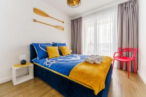 Posteľ alebo postele v izbe v ubytovaní Apartament Słońce i Plaża Kołobrzeg