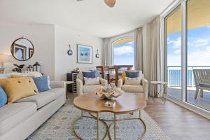 a living room with a couch and a table at Beach Colony East 17B-Penthouse in Perdido Key
