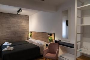 Postel nebo postele na pokoji v ubytování Hotel Ridomar 365