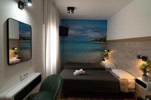 Postel nebo postele na pokoji v ubytování Hotel Ridomar 365