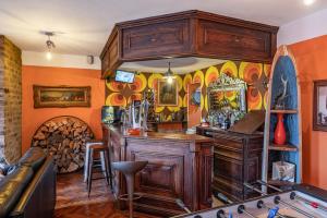 a bar in a room with a bunch of stuff at Moonfleet Boutique Hotel in Skinningrove