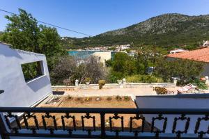 a view from the balcony of a house at Sea Salt Apartments in Samos