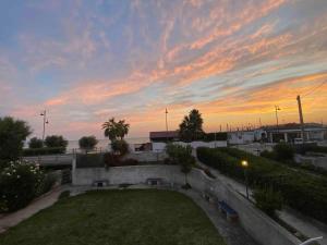 a view of a park with a sunset in the background at Casa a 20 metri dal mare! in Fossacesia