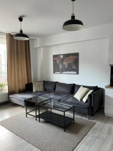 a living room with a couch and a coffee table at Apartament Księcia Janusza in Warsaw