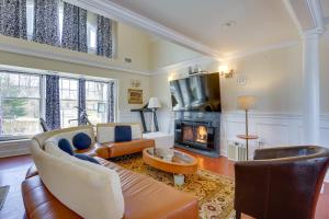 a living room with a couch and a fireplace at Toms River Vacation Rental with On-Site Dock! in Toms River