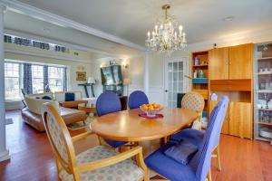 a dining room and living room with a table and chairs at Toms River Vacation Rental with On-Site Dock! in Toms River
