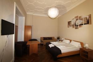 a hotel room with a bed and a couch at Hotel Elegia am Kurfürstendamm in Berlin