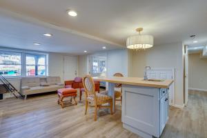 a kitchen and living room with a table and chairs at Toms River Apartment about 5 Mi to Jersey Shore! in Toms River