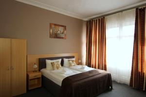 Postel nebo postele na pokoji v ubytování Hotel Elegia am Kurfürstendamm