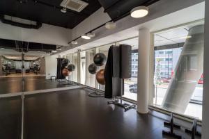 a salon with a row of chairs and windows at Luxury 2-Bed Croydon Apartment Near Gatwick in Croydon