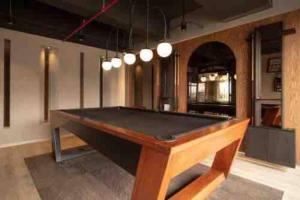 a ping pong table in a large room with at Smart loft Bogota - Chico in Bogotá