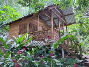 a tree house in the middle of a garden at Reserva Natural Cañón Seacacar in Izabal