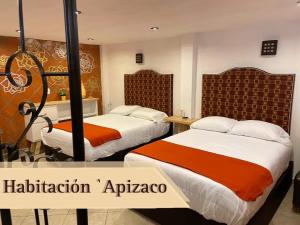 Cama o camas de una habitación en Hotel RioMiel Tlaxcala