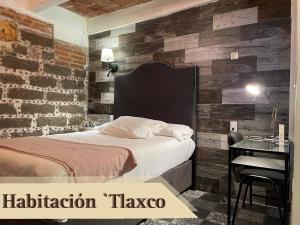 Cama o camas de una habitación en Hotel RioMiel Tlaxcala