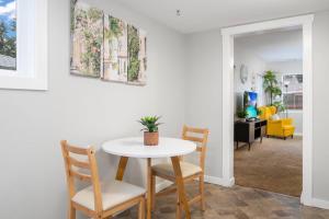 a table and chairs in a living room at Cozy and 3 mins to Tacoma dome. in Tacoma