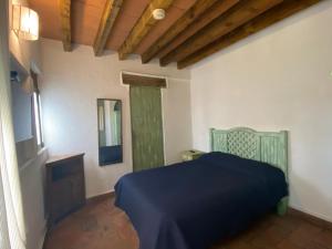 Postel nebo postele na pokoji v ubytování Casa Árbol Hotel