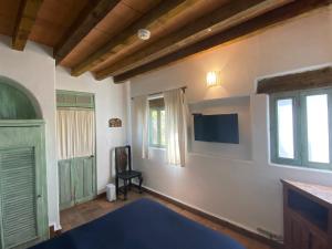 TV a/nebo společenská místnost v ubytování Casa Árbol Hotel