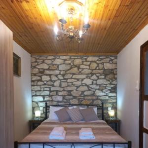 A bed or beds in a room at Lamprou V. House