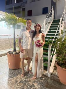 a bride and groom posing for a picture at their wedding at Villa San Miguel in San Andrés