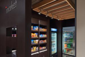 a food pantry with two refrigerators and a refrigerator at Courtyard by Marriott Glassboro Rowan University in Glassboro