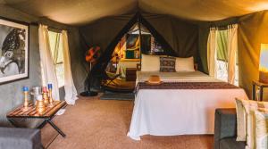 a bedroom with a bed in a tent at Mahoora - Yala by Eco Team in Yala
